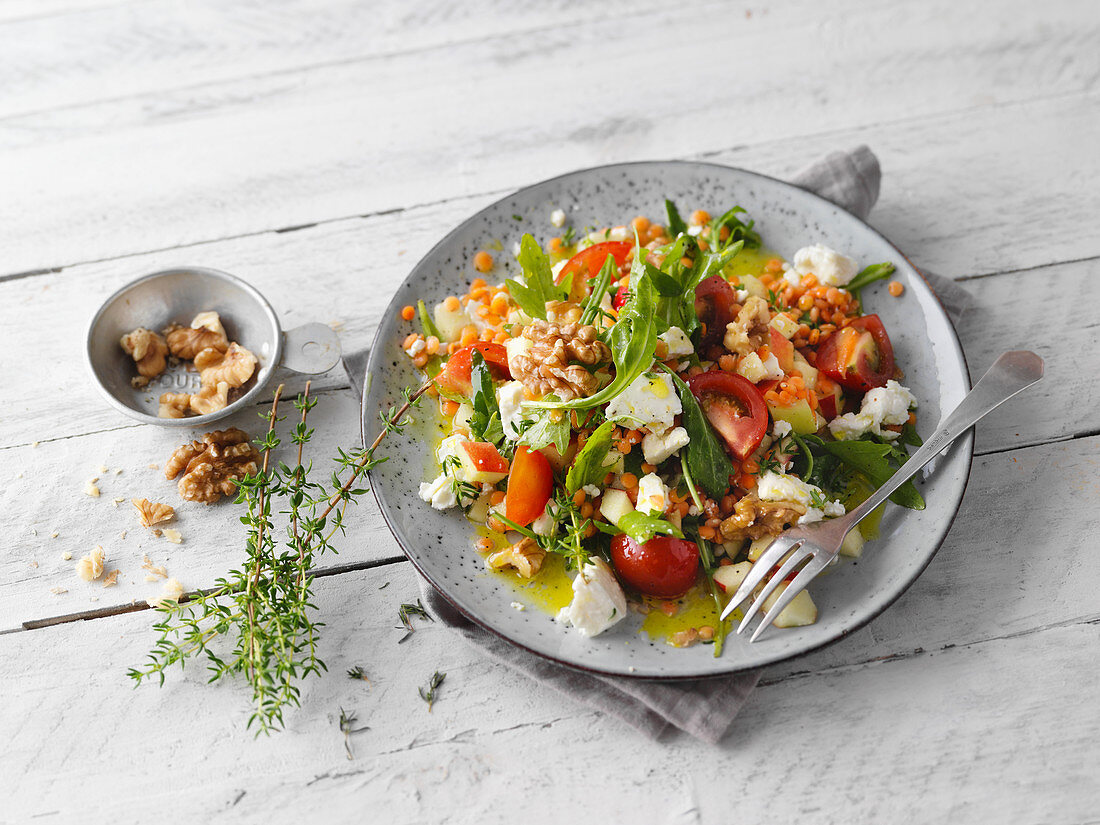 Red lentil salad with apples, sheep's cheese and rocket