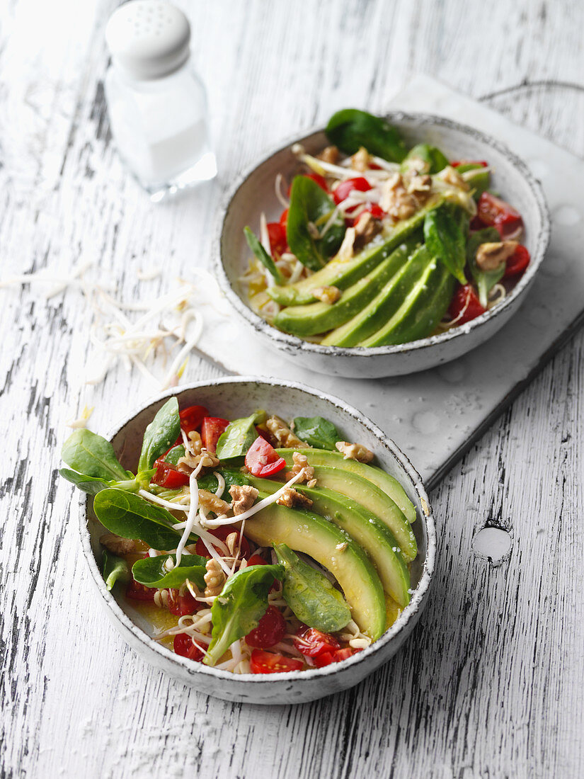 Vegan avocado salad with beansprouts and pine nuts