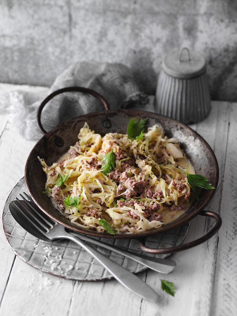 Quick white cabbage and minced meat in a pan