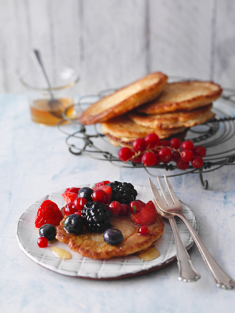 Coconut pancakes with fresh berries and agave syrup