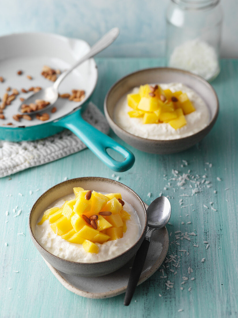 Caribbean coconut dessert with mango and pine nuts