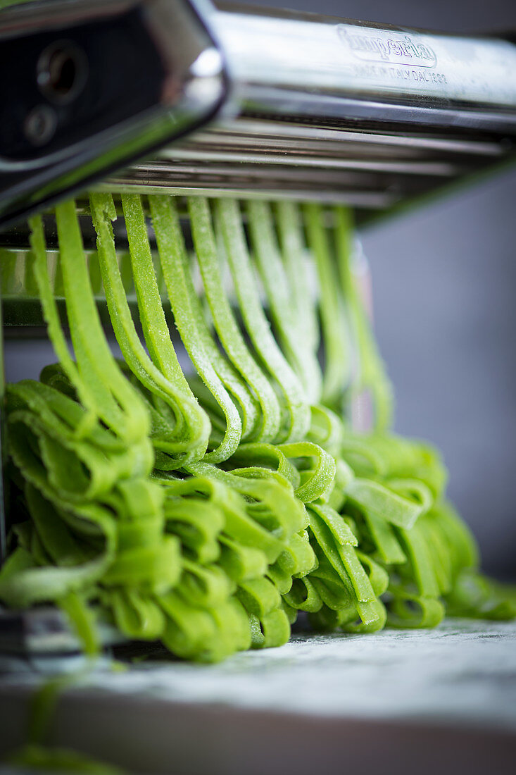 Homemade wild garlic pasta in a pasta machine