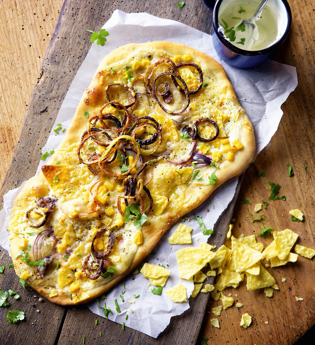 Tex-Mex pizza bianca with sweetcorn, turkey breast and red onions