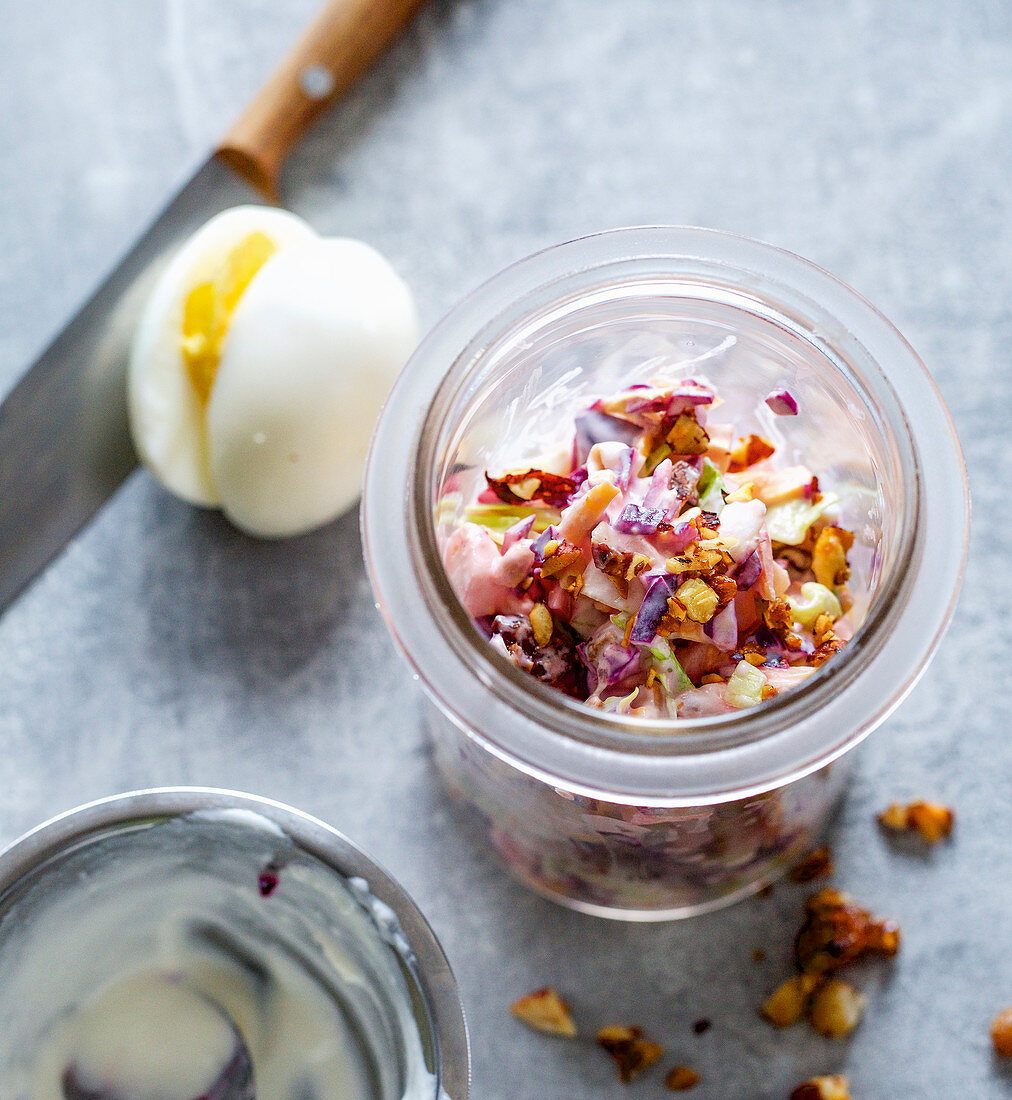 Confetti salad with hard-boiled eggs, red cabbage, apples and raisins