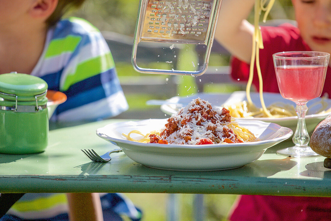 Spaghetti Bolognese with freshly grated Parmesan cheese for children