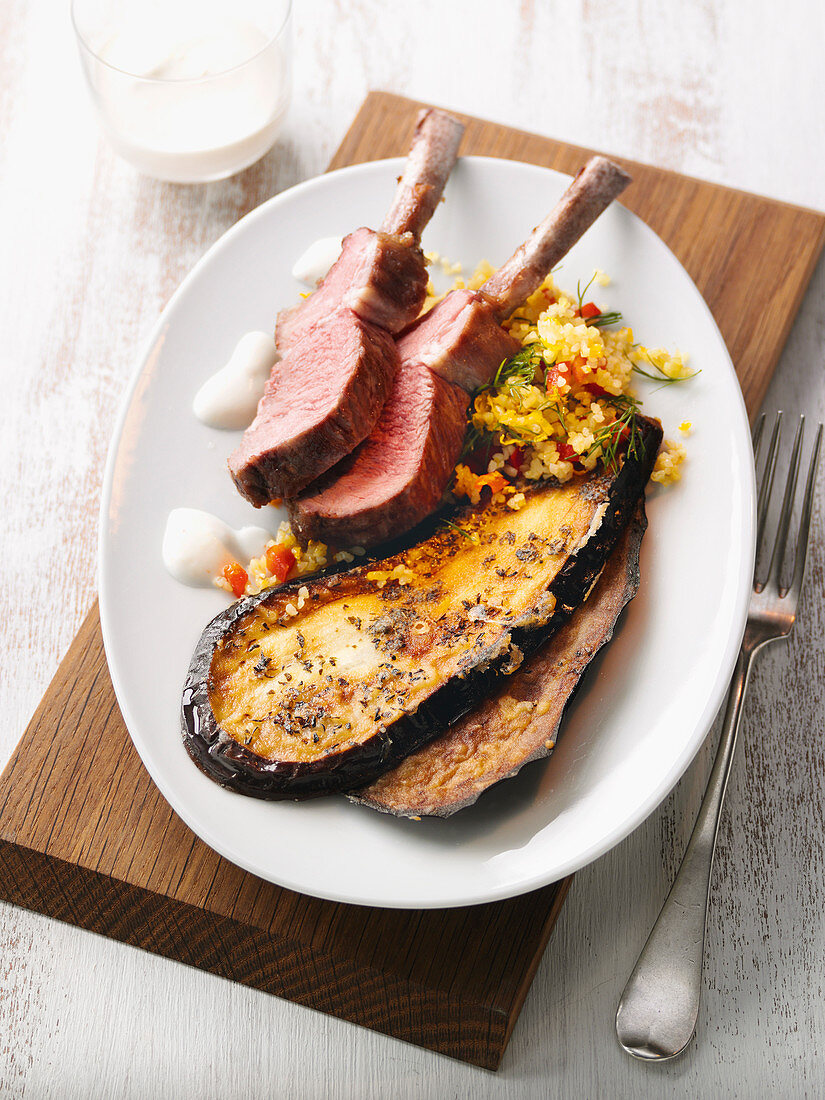 Lamb chops on pepper and bulgur wheat salad with roasted aubergines