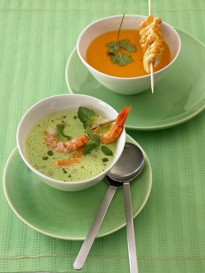 Pea soup with shrimps, and carrot soup with poultry skewers