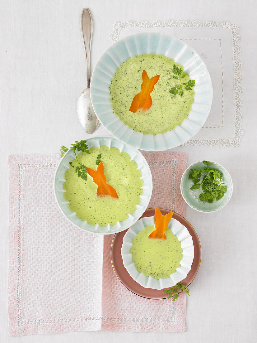 Herb soup with carrot bunnies