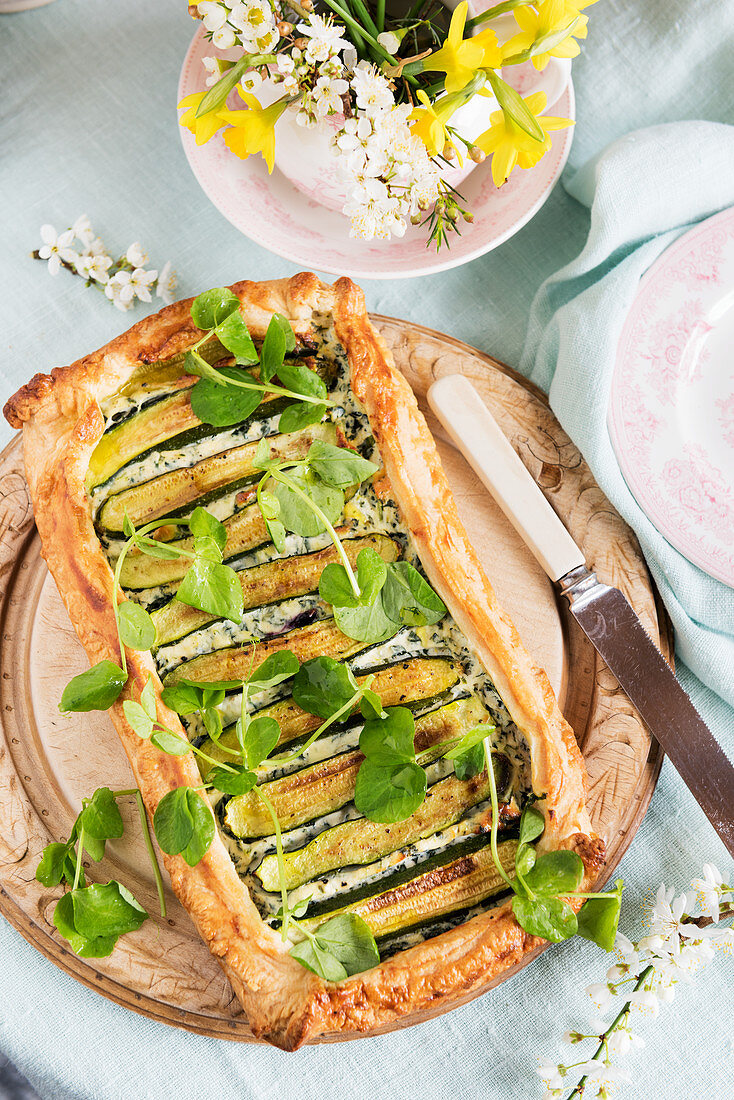 Spring shortbread tart with zucchini, ricotta and watercress