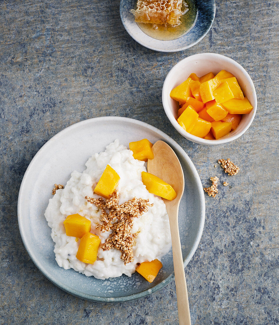 Coconut rice with mango and honey sesame seeds