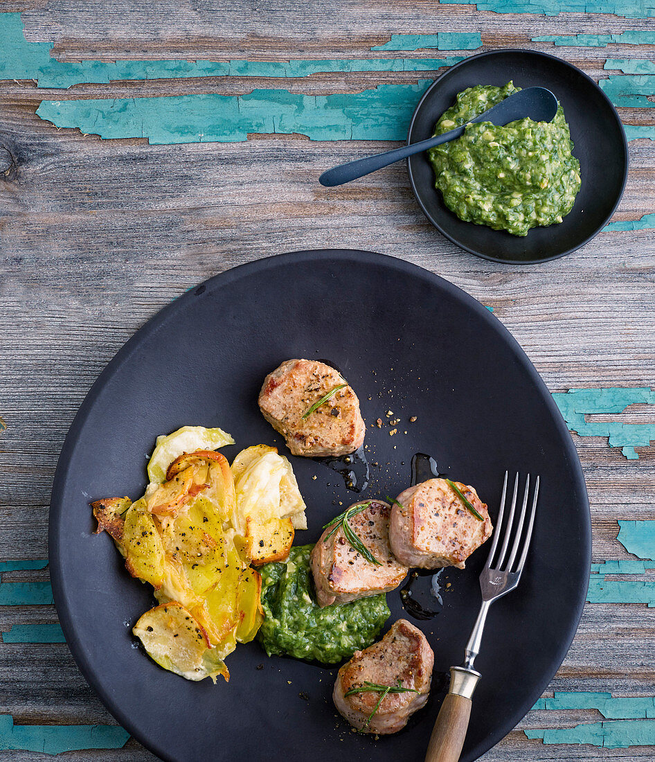 Pork fillets with lambs lettuce pesto and potato and apple bake