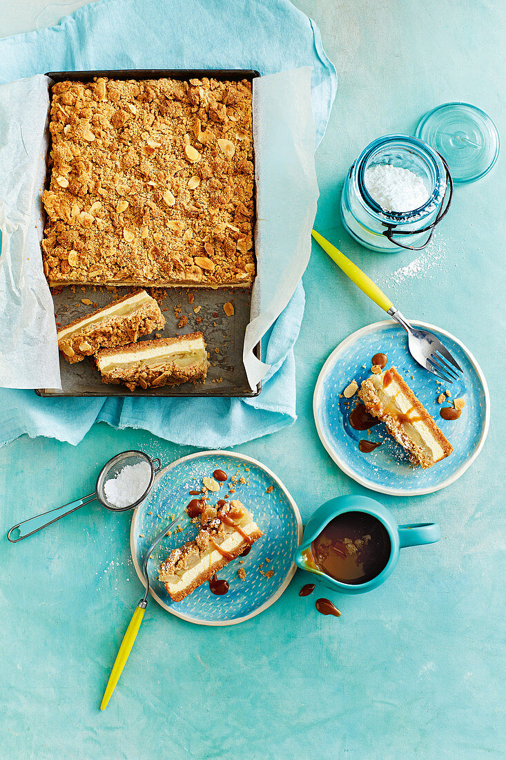Apple pie and cheesecake tray bake slices with caramel sauce
