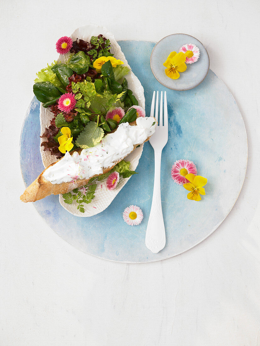 Lettuce with watercress, edible flowers, herbs and crostini