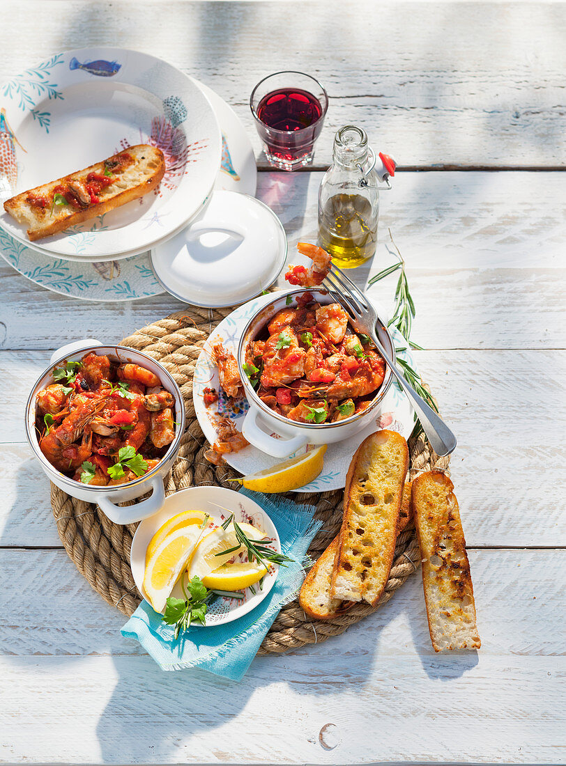 Seafood dip with tomatoes and grilled bread