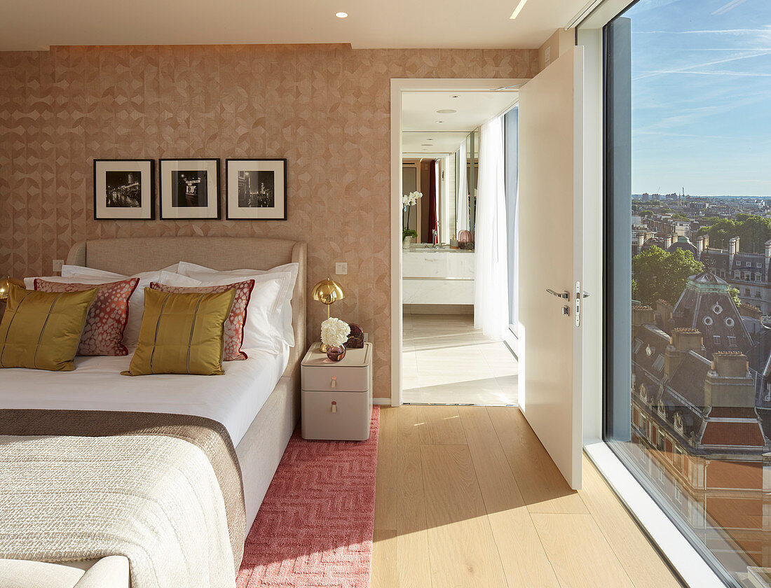 Bedroom with floor-to-ceiling windows and view of London