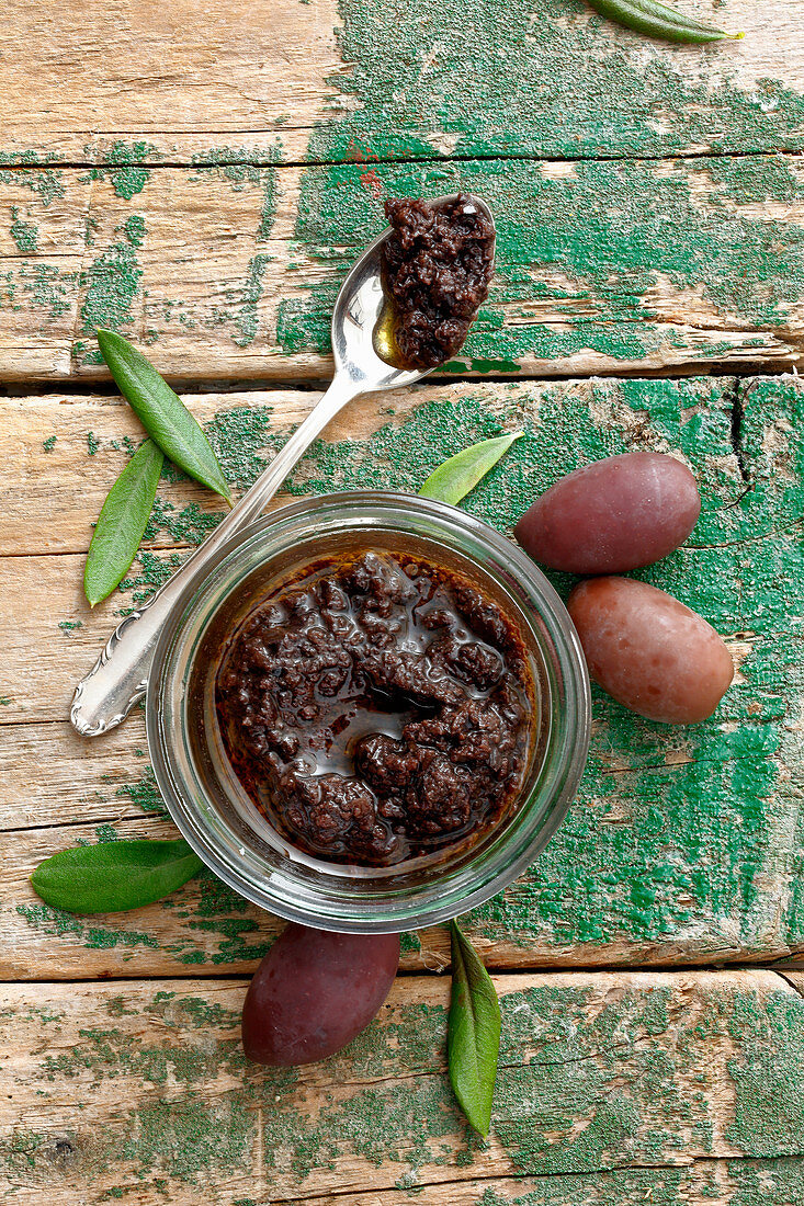 Homemade olive tapenade in a jar (seen from above)