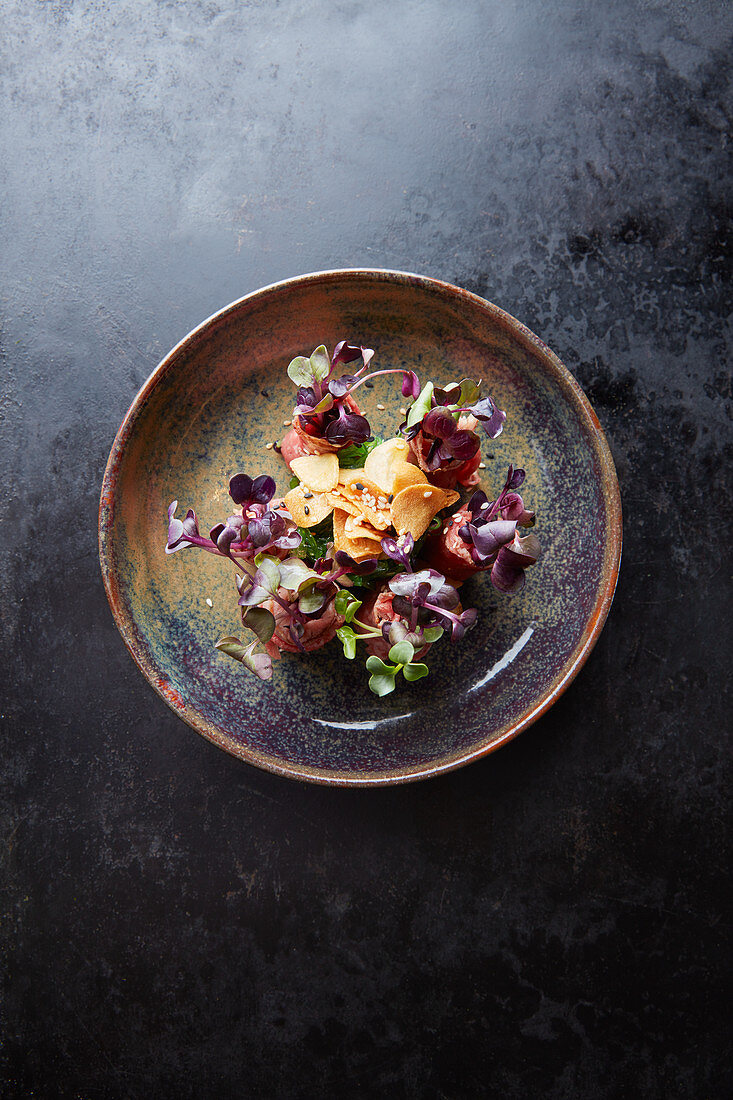 Wagyu beef Tataki with crispy garlic and sprouts