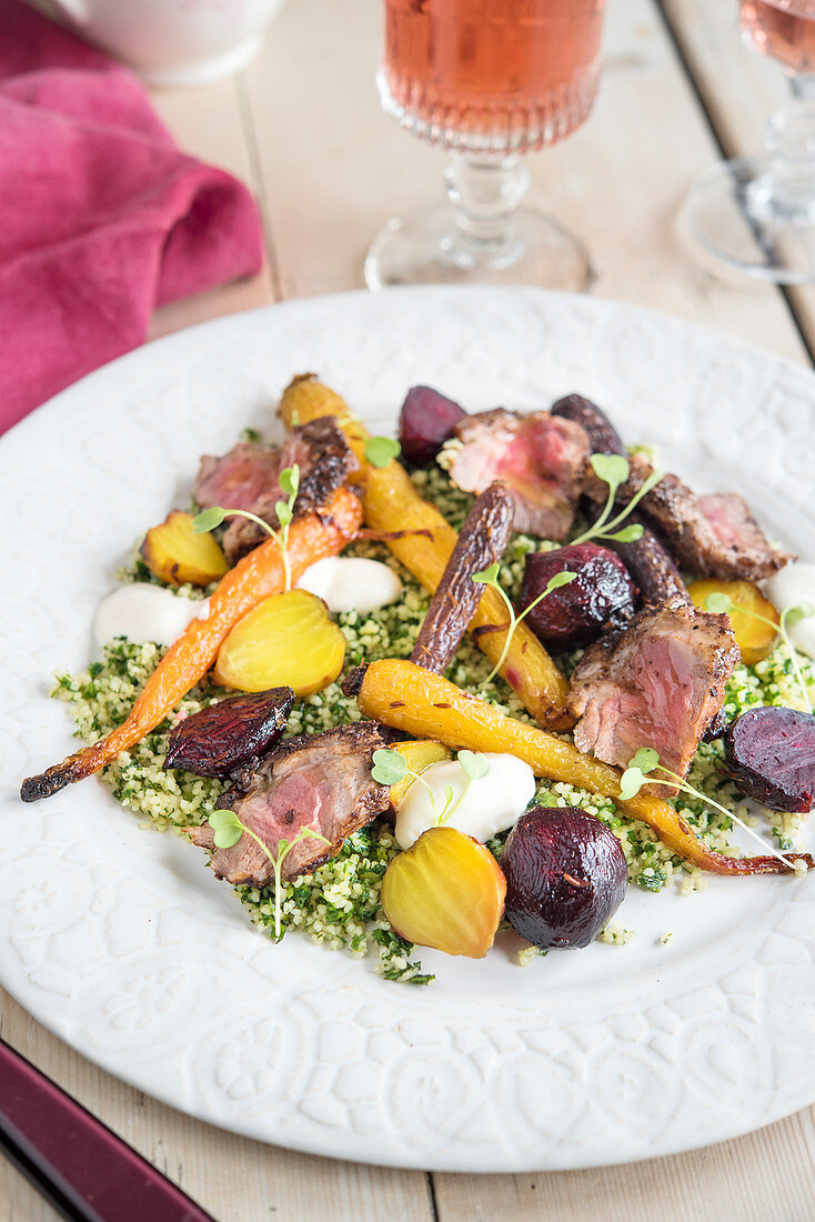 Lamb with beetroot on a bed of herb couscous
