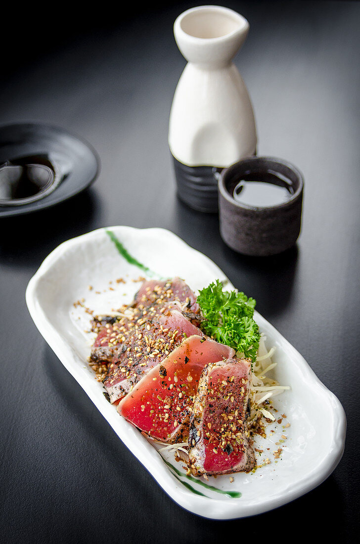 Japanese maguro tataki (seared tuna fillets covered in chopped nori and sesame seeds with a light shoyu based dressing)