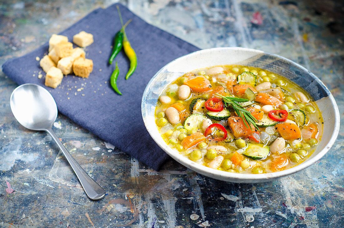 Earthy minestrone soup with fresh vegetables in broth