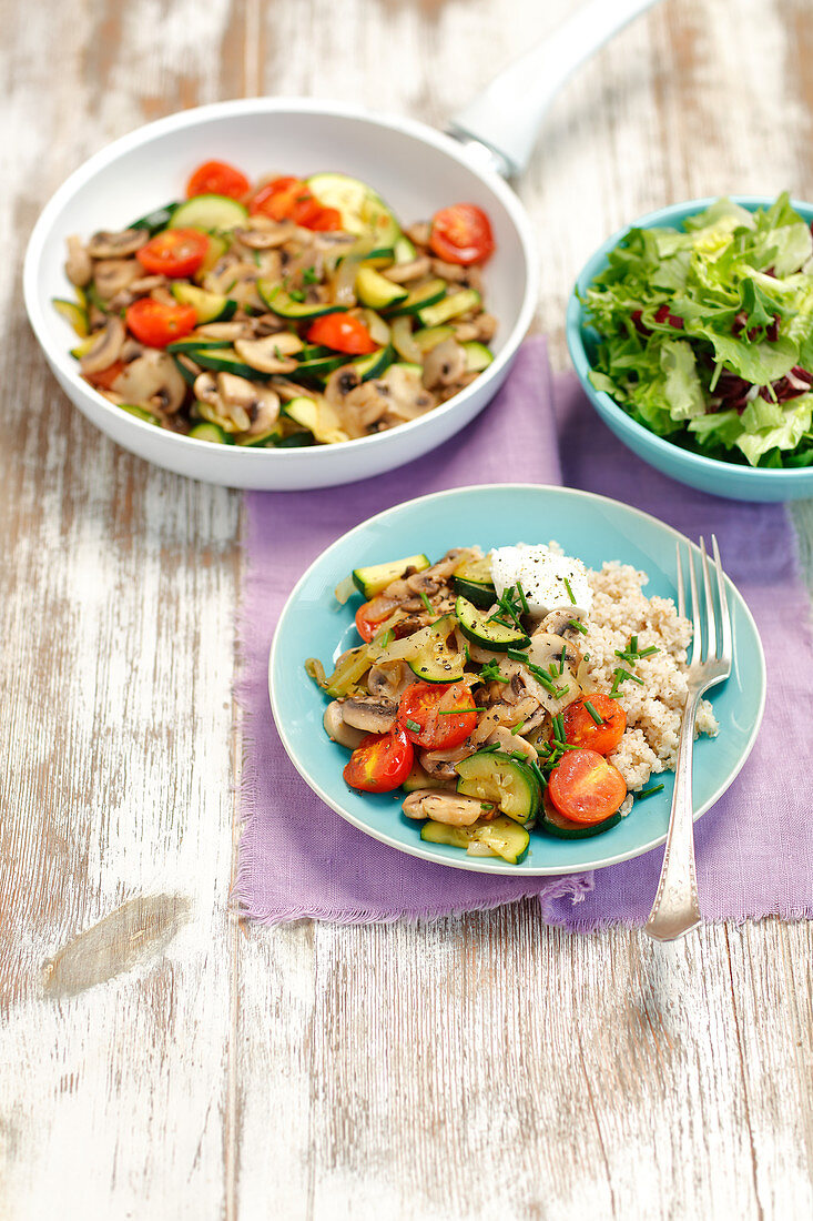 Fried mushrooms with courgette and cherry tomatoes served with barley