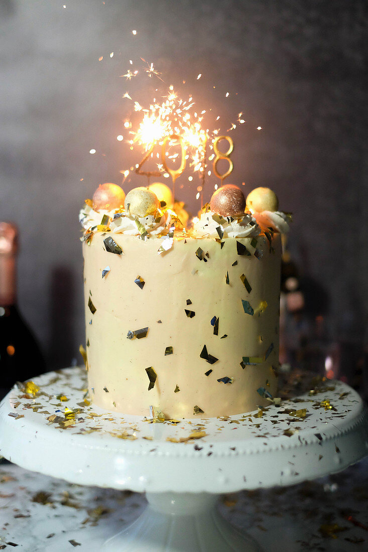 A New Year's Eve cake with champagne and sparklers