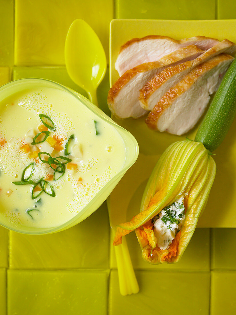 Lemon soup with chicken breast and stuffed courgette flowers