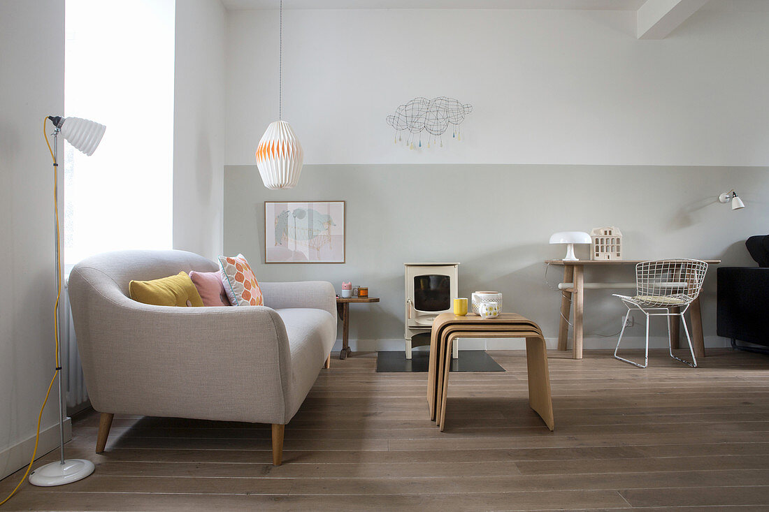 Sofa, nest of tables, desk and classic chair in living room