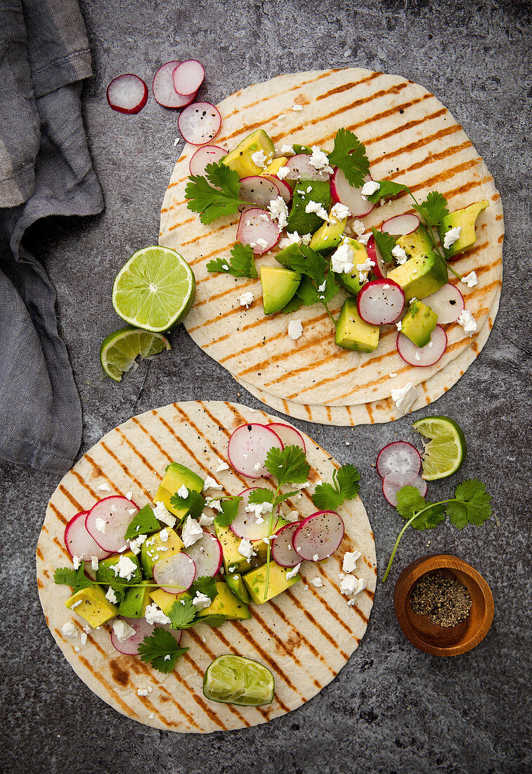 Taco wraps with avocado, radishes and feta