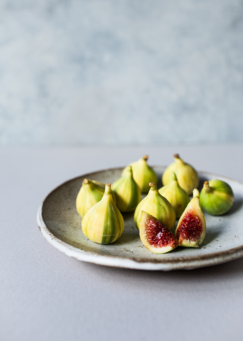 Fresh yellow tiger figs on a dish