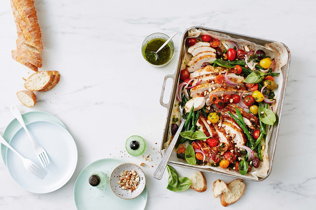 One-pan roast chicken with green bean, almond and salsa verde salad