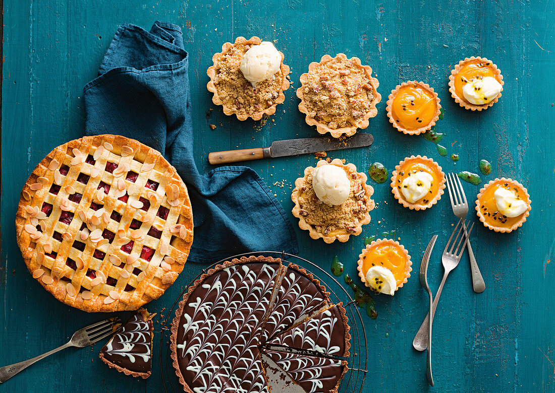 Fruit pie, chocolate cake, plum tarts, and passion fruit tarts