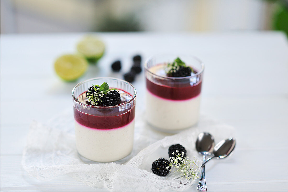 Blackberry and lime curd with coconut and cashew yoghurt-cream in glasses (vegan)