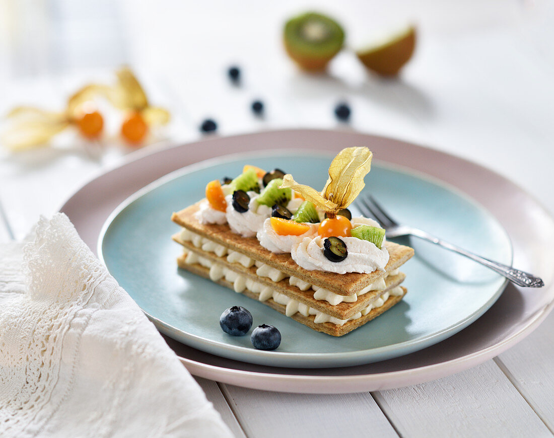 Mille feuille with vanilla cream, kiwis, blueberries and physalis (vegan)