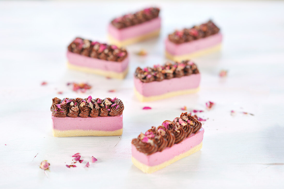 Raw raspberry and hazelnut slices, sprinkled with cocoa nibs and rose petals (vegan)