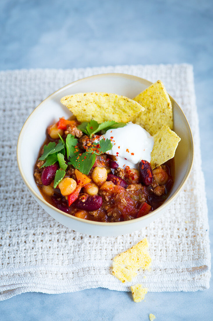 Chili con carne with beans and chickpeas in a small bowl