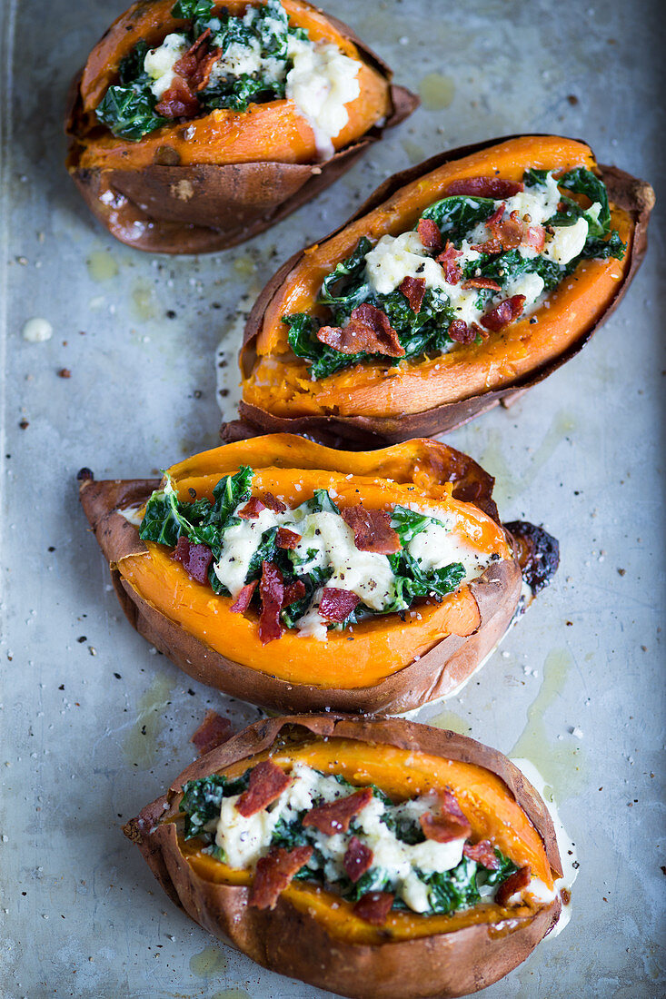 Sweet potatoes stuffed with kale, prosciutto di parma and cheese