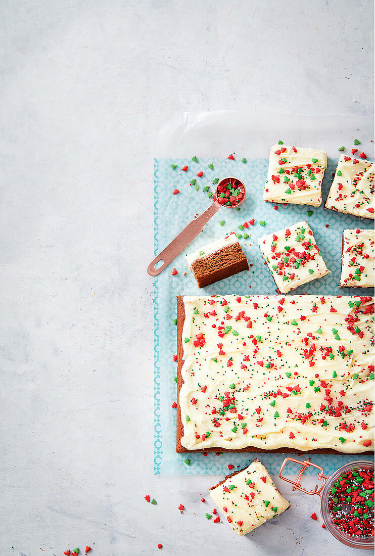 Spice cake tray bake with buttercream and sugar sprinkles