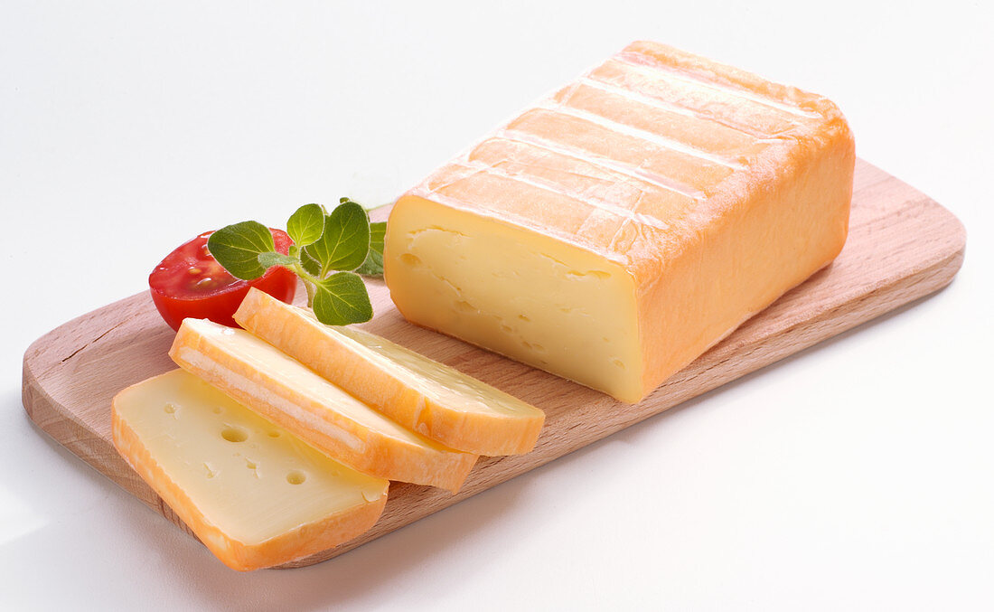 Limburger, sliced on a wooden board