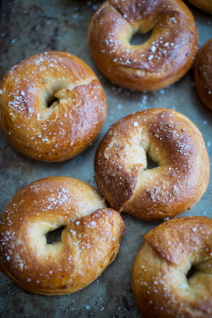Crisp bagels with sea salt on a baking tray