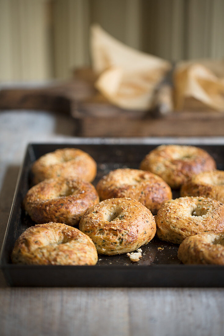 Homemade bagels on a baking tray