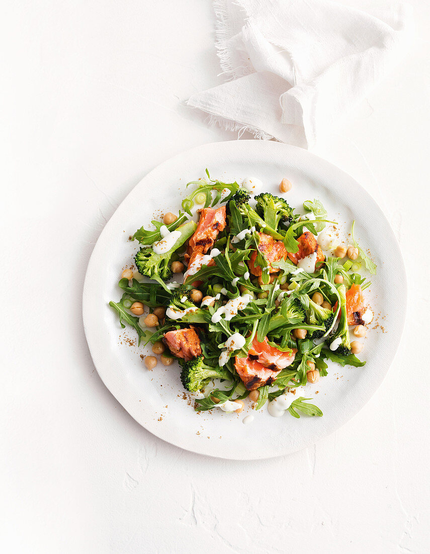 Spiced salmon with chickpea, broccoli and rocket salad with yoghurt dressing