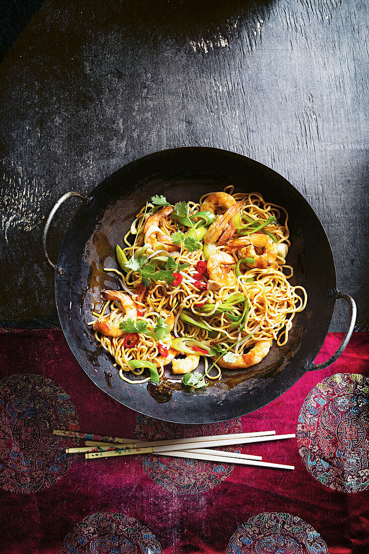 Spiced longevity noodles with coriander and prawns (China)