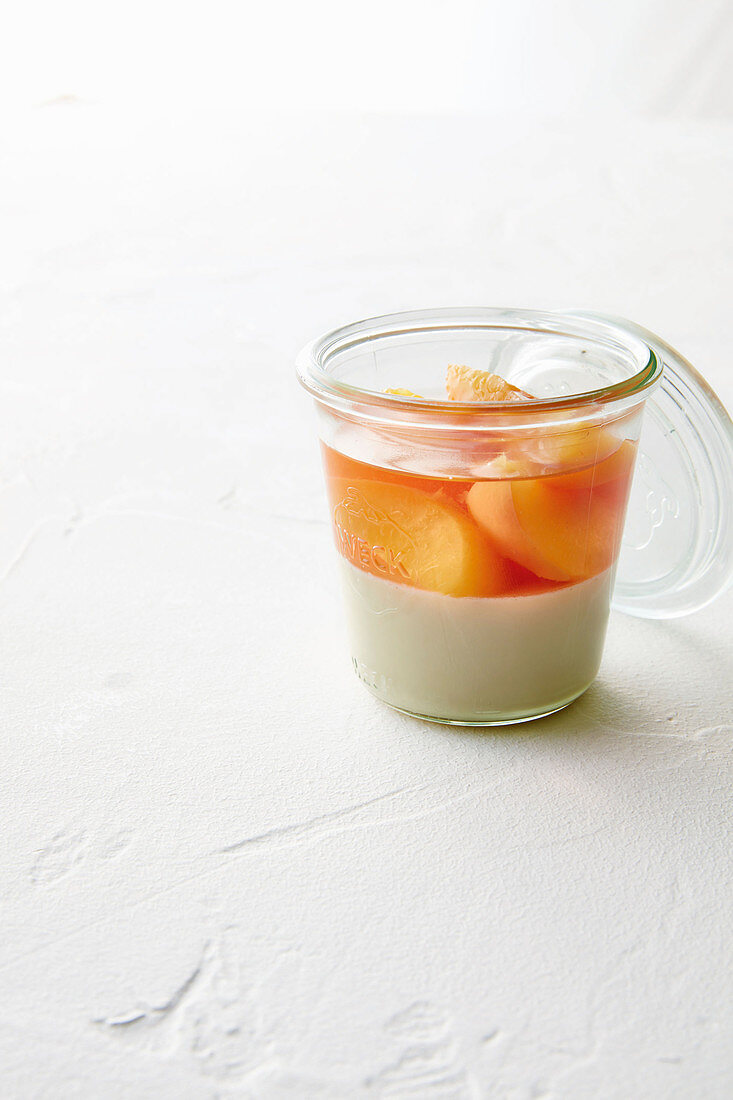 Burnt honey panna cotta with poached nectarines