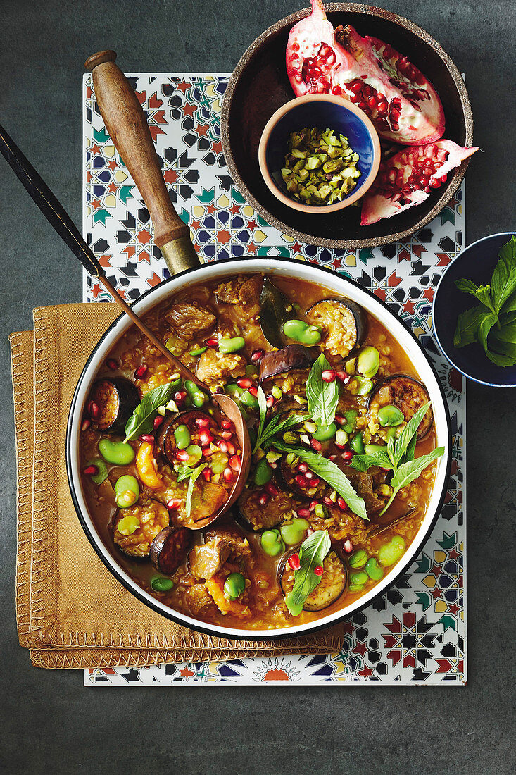 Lamb, eggplant, and freekeh stew with pomegranate seeds (Persia)
