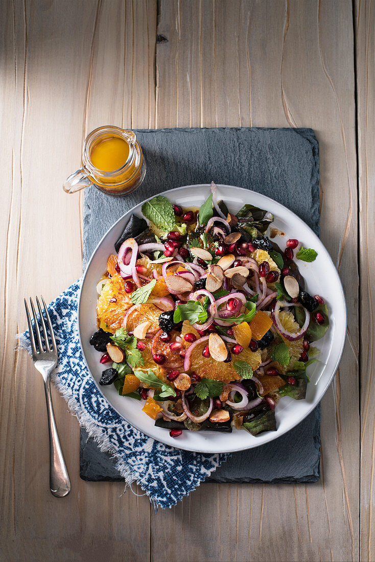 Moroccan orange salad with pomegranate, onions and almonds