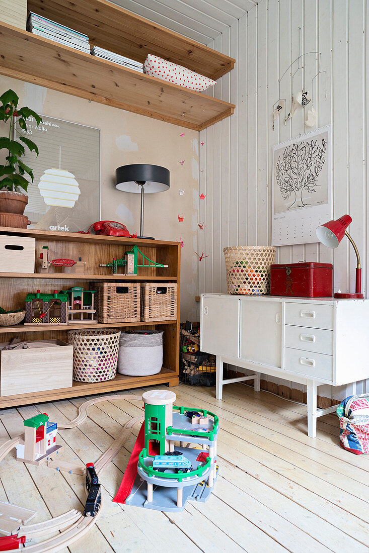 Old sideboard and baskets of toys on shelves