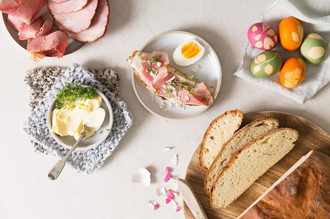 An open ham sandwich, Easter eggs, butter and cress