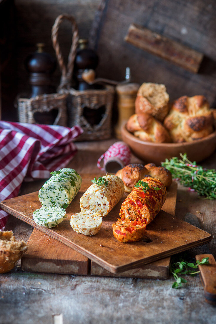 Three different rolls of herb and spice butter