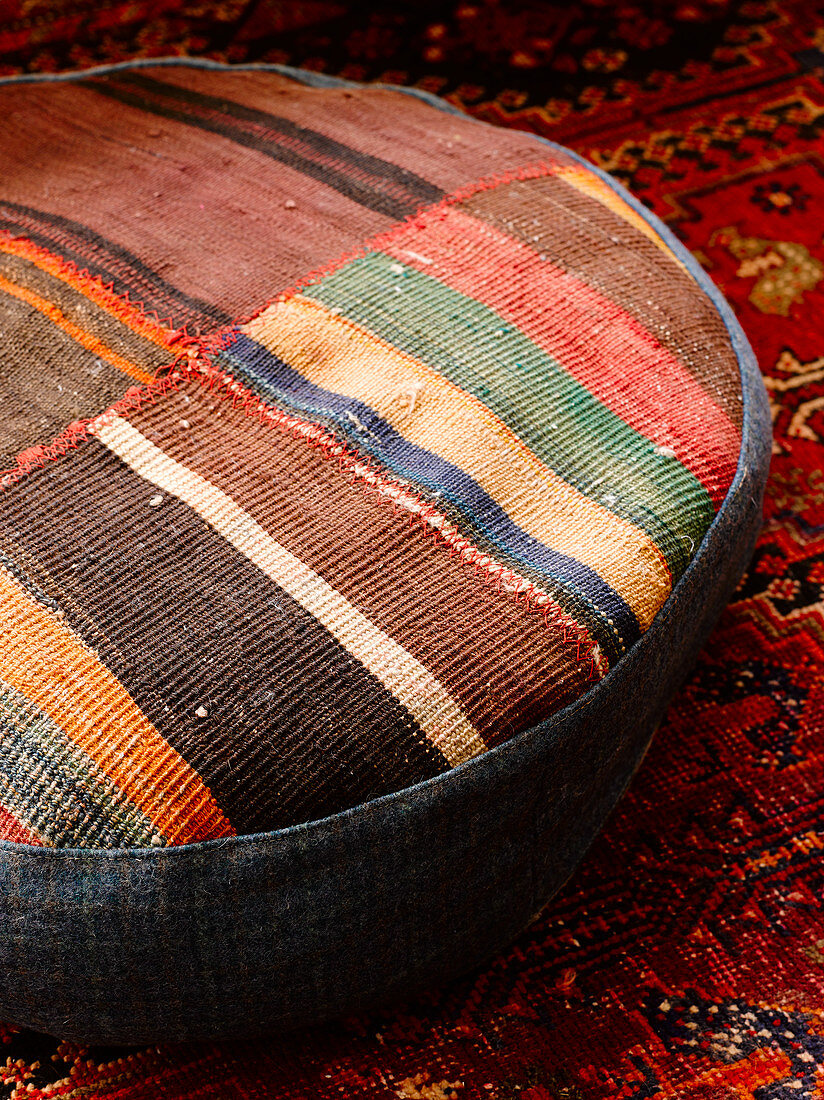 Floor cushion made from pieces of carpet